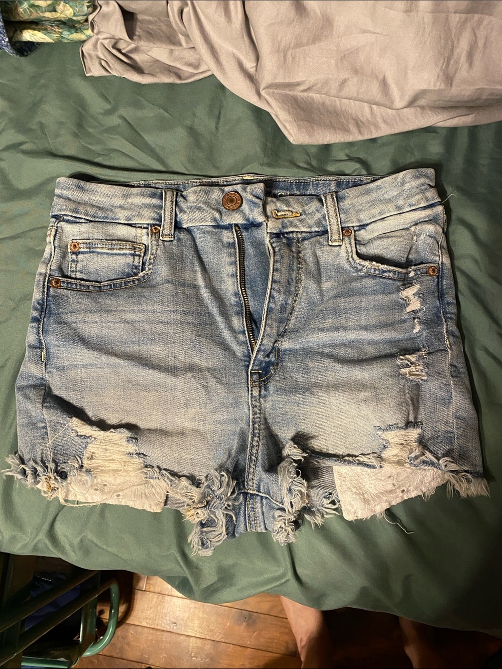 American Eagle Curvy Hi-Rise distressed lace pocket Shortie denim shorts